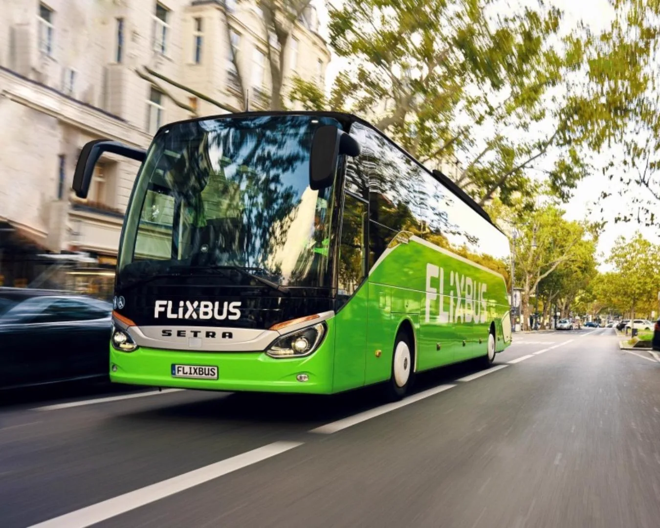 FlixBus green coach on city street