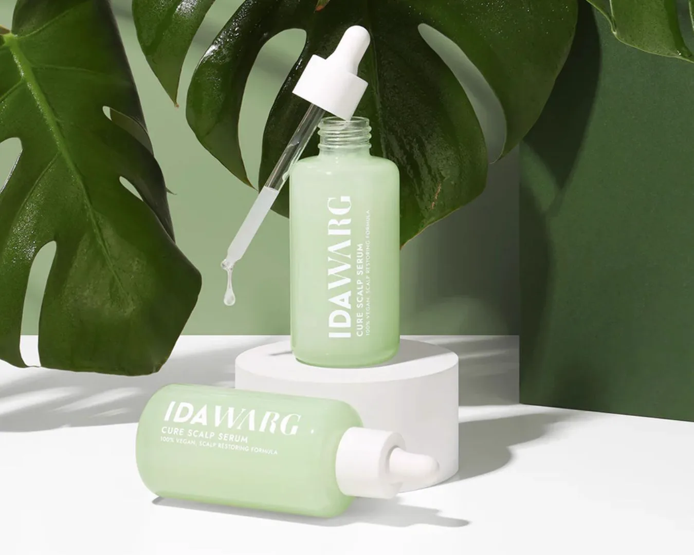 IDA WARG Cure Scalp Serum product with monstera leaves