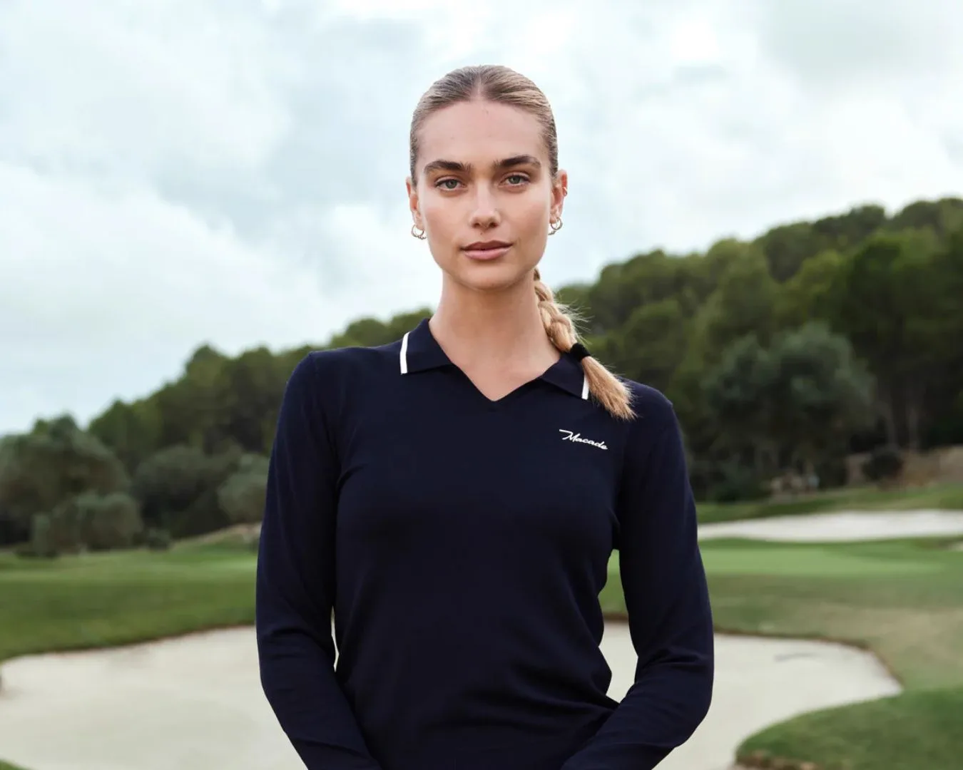 Model wearing Macade Golf apparel on course